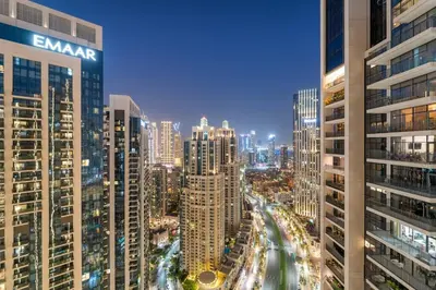 a view of a city at night with buildings at FIRST CLASS 4BR Spacious Luxury Retreat in Dubai