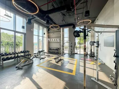 a gym with treadmills and machines in a room at FIRST CLASS Luxury 2BR in Creek Harbour Pool, Gym, Walk to Dining in Dubai