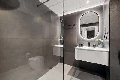 a bathroom with a toilet and a sink and a mirror at Full Sea View - Spacious & Newly Renovated Studio in JBR in Dubai