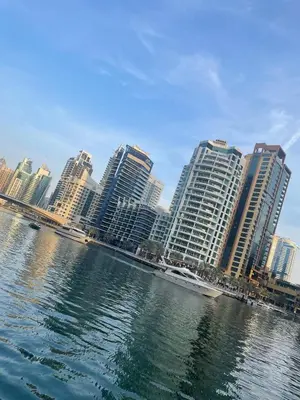 a city with tall buildings and a body of water at Four Stars Dubai Marina JBR in Dubai Marina