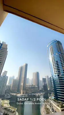 a view of a city skyline from a window at Four Stars Dubai Marina JBR in Dubai Marina