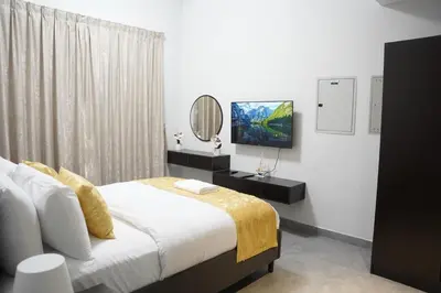 a bedroom with a large bed and a mirror at Ista Vacation Homes Rental LLC KARAMA in Dubai