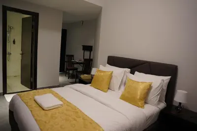a bedroom with a large bed with yellow pillows at Ista Vacation Homes Rental LLC KARAMA in Dubai
