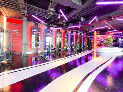 an empty gym with purple lights on the floor at Brand New Studio - Comfy & WFH in Dubai
