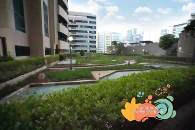 a view of a park in a city with buildings at Nomad Partition Room in Barsha Heights 3 mins to ICM Metro in Dubai