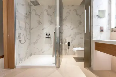 a bathroom with a shower and a toilet at The Address Residences Dubai Opera, Full Burj Khalifa View, 2BR Downtown Luxury in Dubai