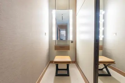 a dressing room with two chairs and a mirror at The Address Residences Dubai Opera, Full Burj Khalifa View, 2BR Downtown Luxury in Dubai