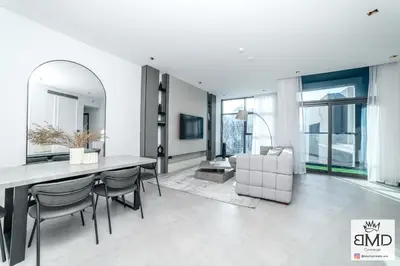 a living room with a dining table and a couch at Mordern Burj khalifa View 2bd in Dubai