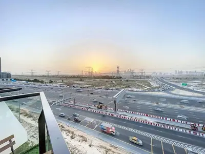 a view of a busy highway with cars on it at Locations I Binghatti Gate I Premium Modern 2BR I Skyline & Community Views I Spacious & Comfortable Stay in Dubai