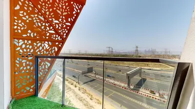 a view of a highway from the balcony of a building at Locations I Binghatti Gate I Premium Modern 2BR I Skyline & Community Views I Spacious & Comfortable Stay in Dubai
