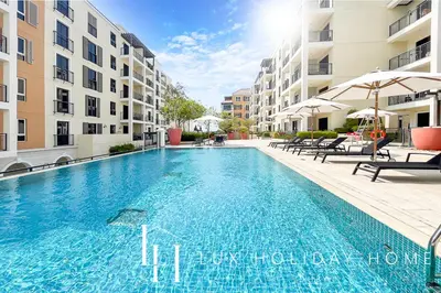a swimming pool in the middle of a building at LUX The Elegant Sea View Suite in Dubai