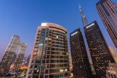 a group of tall buildings in a city at FIRST CLASS 2BR Premium City Escape in Dubai