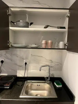 a kitchen with a sink and a counter top at Ista Vacation Homes LLC in Dubai