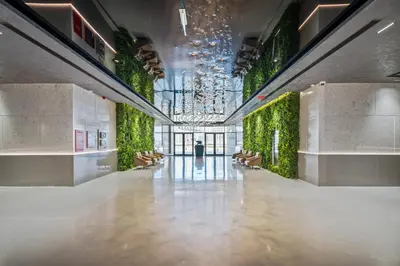 a hallway of a building with a green wall at Stylish Studio Near Dubai Academic City in Dubai