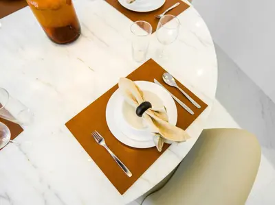 a table with a plate with a banana on it at Amazing 2BDR with Lagoon view in District One 13 Al Merkadh in Dubai