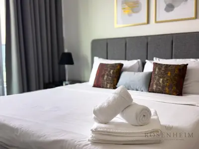a hotel room with a bed with towels on it at Elevated Living at The Bay - Canal & Khalifa Views in Dubai