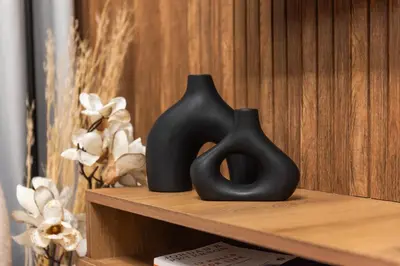 two black vases sitting on top of a shelf at Dubai Hills - 1BR Luxe Apartment - Golfville - by UDH in Dubai