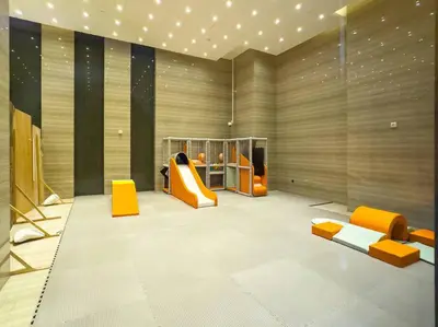 a room with a playground with a slide at Luxury Apt in Business Bay Water canal view in Dubai