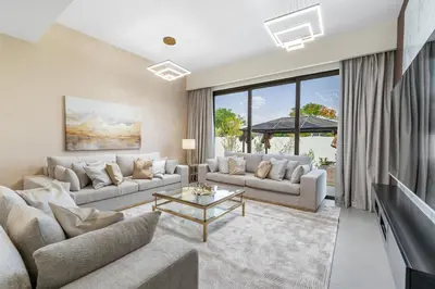 a living room with two couches and a table at NewArabian Sidra1 -4 BR & Maid in Dubai