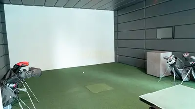 a room with a white wall and a room with cameras at Stylish Brand New 1 Bedroom in Dubai