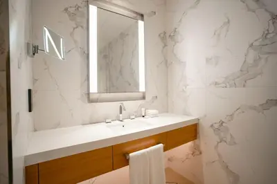 a bathroom with a sink and a mirror at Address Opera 2BR Apartment 54th Floor in Dubai