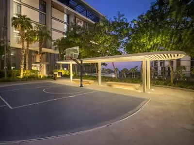 a basketball court in front of a building at Bluewaters 5BR Panoramic Eye of Dubai Views Near JBR Beach in Dubai