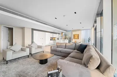 a living room with a couch and a table at Bluewaters 5BR Panoramic Eye of Dubai Views Near JBR Beach in Dubai