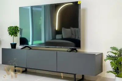 a large mirror on top of a dresser in a room at Marco Polo - Experience elegant living in JVC Dubai in Dubai