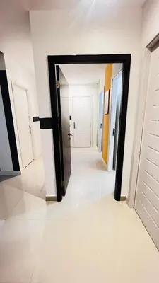a hallway with a mirror in the middle of a room at Escape Partition Room in Barsha 1 Near MOE Metro in Dubai