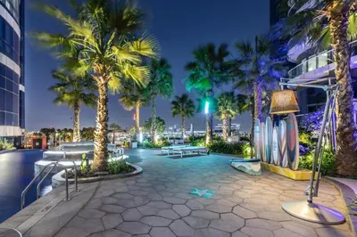 a courtyard with palm trees and a building at DAMAC Towers by Paramount Hotels & Resorts Dubai in Dubai