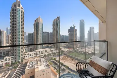 a balcony with a view of a city skyline at Luxurious 1-Bedroom Apartment in Dubai