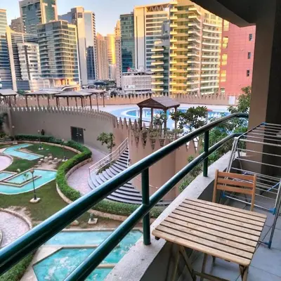 a balcony with a bench and a view of a city at Vista Partition Room in Tecom Near Internet City Metro in Dubai