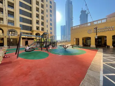 a playground in the middle of a city with buildings at Luxury Studio in Murjan 2, JBR in Dubai