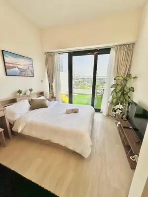 a bedroom with a large bed and a large window at Cozy Retreat, Relax and Explore in Dubai