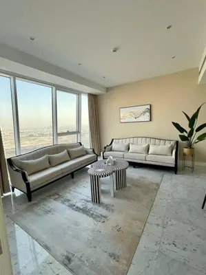 a large living room with two couches and a table at 1BDR-furnished apartment, Business Bay, CANAL VIEW in Dubai