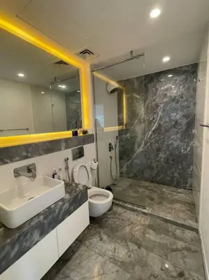 a bathroom with a sink and a toilet and a shower at 1BDR-furnished apartment, Business Bay, CANAL VIEW in Dubai