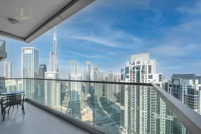 a balcony with a view of a city skyline at Luxury 2-Bed in Paramount Midtown Hotel Full Burj Khalifa Views 64th Floor Pool & Burj Views in Dubai