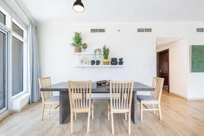 a dining room with a table and chairs at Premium Home with Panoramic Burj Khalifa Views in Dubai