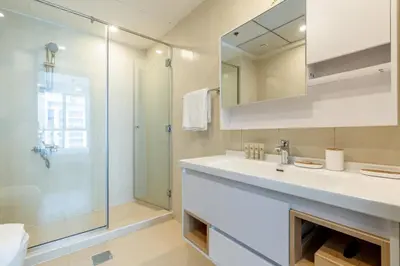 a bathroom with a sink and a shower at Stunning Interior in an deal Location in Dubai