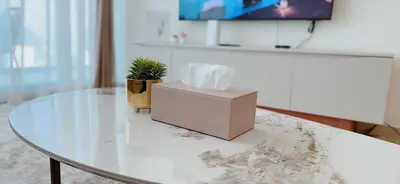a box sitting on top of a glass table at Modern 1br In Jvc Balcony, Pool & Free Parking in Dubai