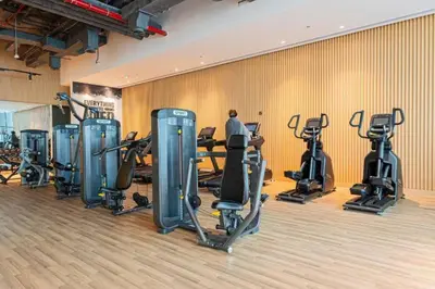 a gym with a bunch of exercise bikes in a room at Luxurious Studio In Seven Palm Hotel & Apartments in Dubai
