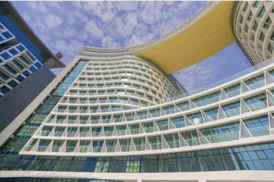 a tall building with a lot of windows at Luxurious Studio In Seven Palm Hotel & Apartments in Dubai