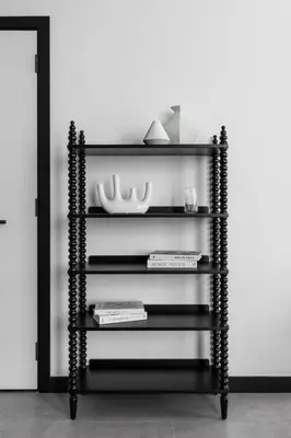 a black book shelf with books and plates on it at Rare Luxury 1bdr 15 Northside in Dubai