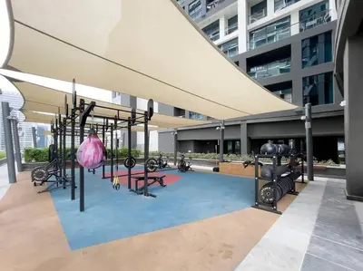 a gym in a building with a playground at Rare Luxury 1bdr 15 Northside in Dubai