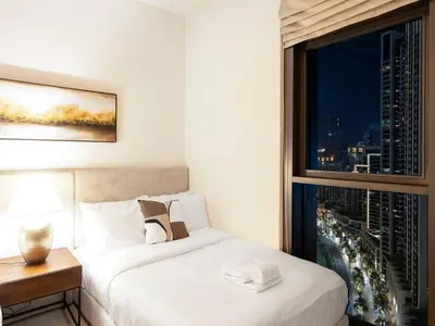 a hotel room with a bed and a window at 2BR-Downtown Apartment- 10 Min Walk to Dubai Mall in Dubai