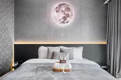 a bedroom with a bed with a moon on the wall at Cosmic Sky Suite High floor 1BR- Dubai Mall Access by Maxx Value Homes in Dubai