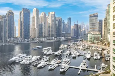 a group of boats docked at a marina in a city at Extra Spacious Home with Stunning Marina Views in Dubai