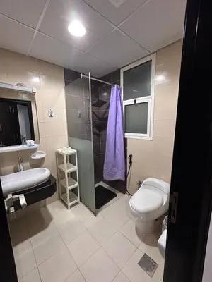 a bathroom with a toilet and a shower and a sink at Luxury Studio Apartment In Dubai Marina in Dubai