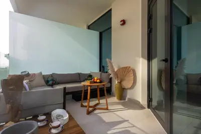 a living room with a couch and a table at Old Form in Dubai