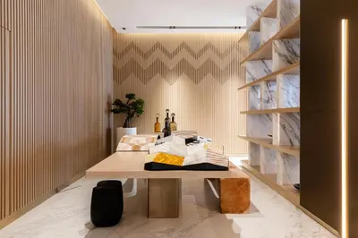 a dining room with a table and a shelf at Old Form in Dubai